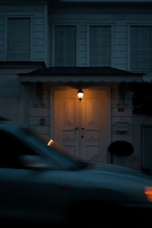 A welcoming real estate office entrance in La Consulta, San Carlos, with a warm sunset glow.