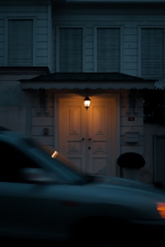 Night view of a business entrance with an automatic door opening smoothly as customers arrive.