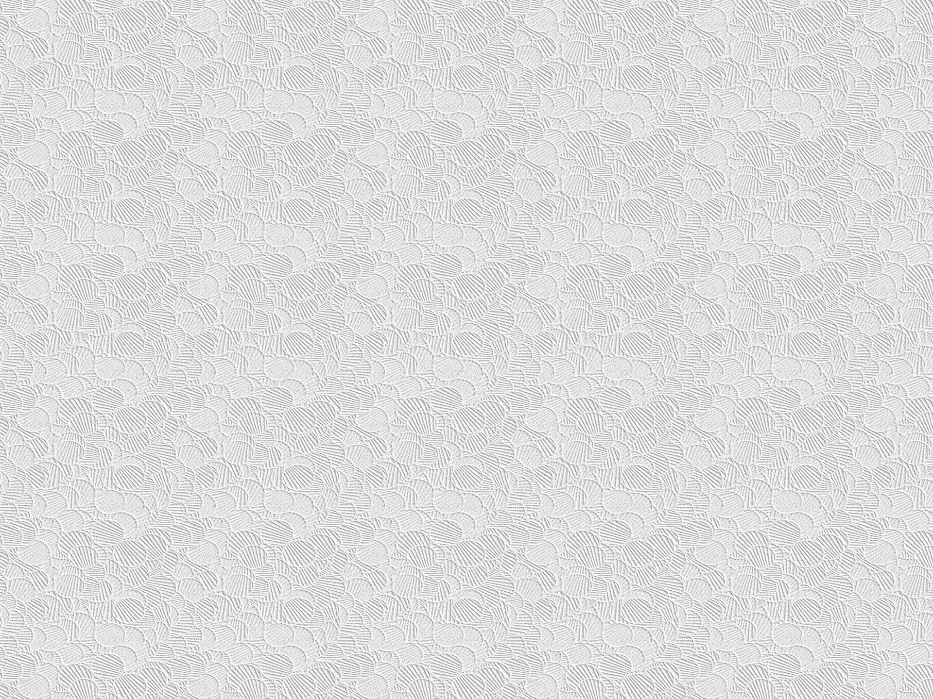 a white textured wallpaper with circles on it
