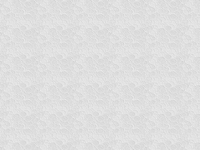 a white textured wallpaper with circles on it