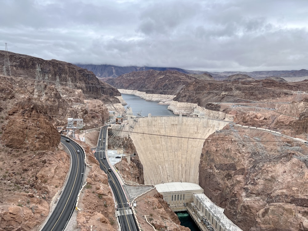 a view of a bridge over a river in a canyon