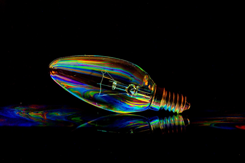 a colorful light bulb sitting on top of a table