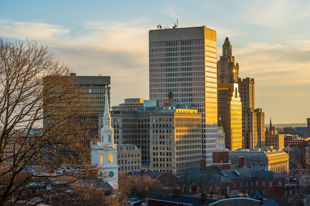 a city skyline with tall buildings and a clock tower