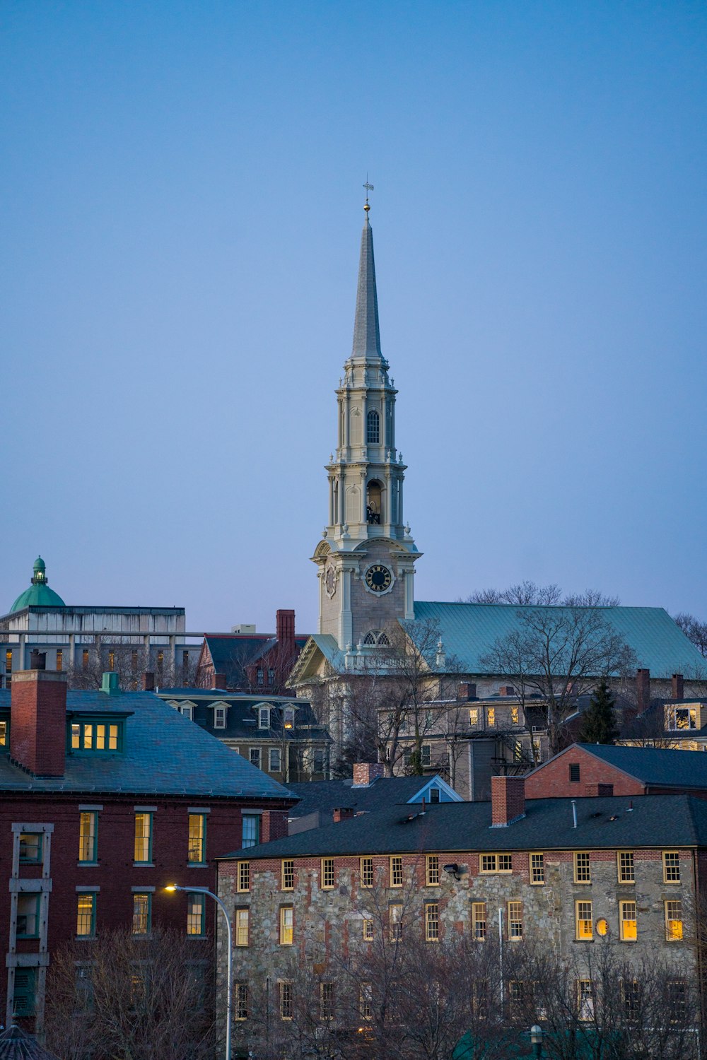 a church steeple lit up at night