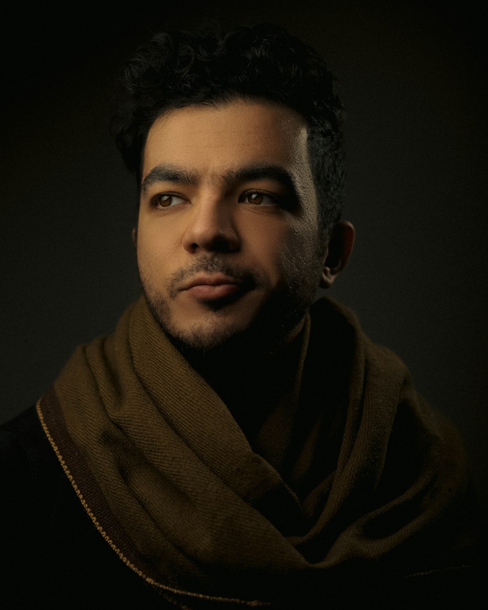 a man with a scarf around his neck