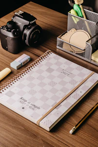 A neatly arranged office desk featuring deskmate's file organizers, pens, and binding supplies in various styles.
