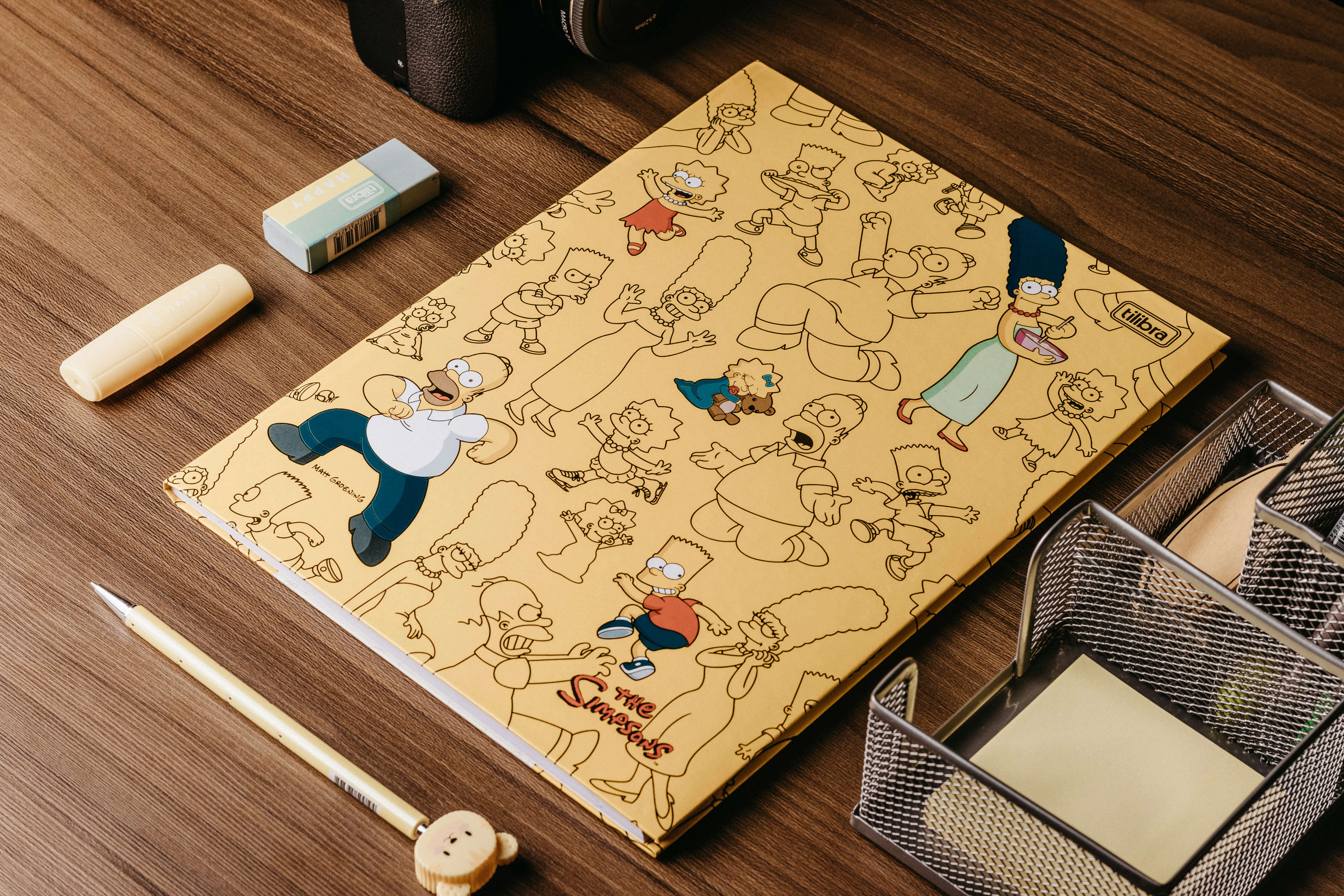 Cartoon notebook on wooden desk