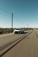 Car driving on a highway with clear skies