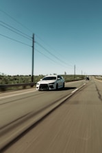 Car driving on a highway with clear skies