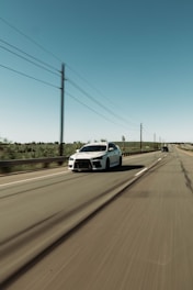 Red truck speeding on a highway between Brasília and Goiânia under a clear sky.