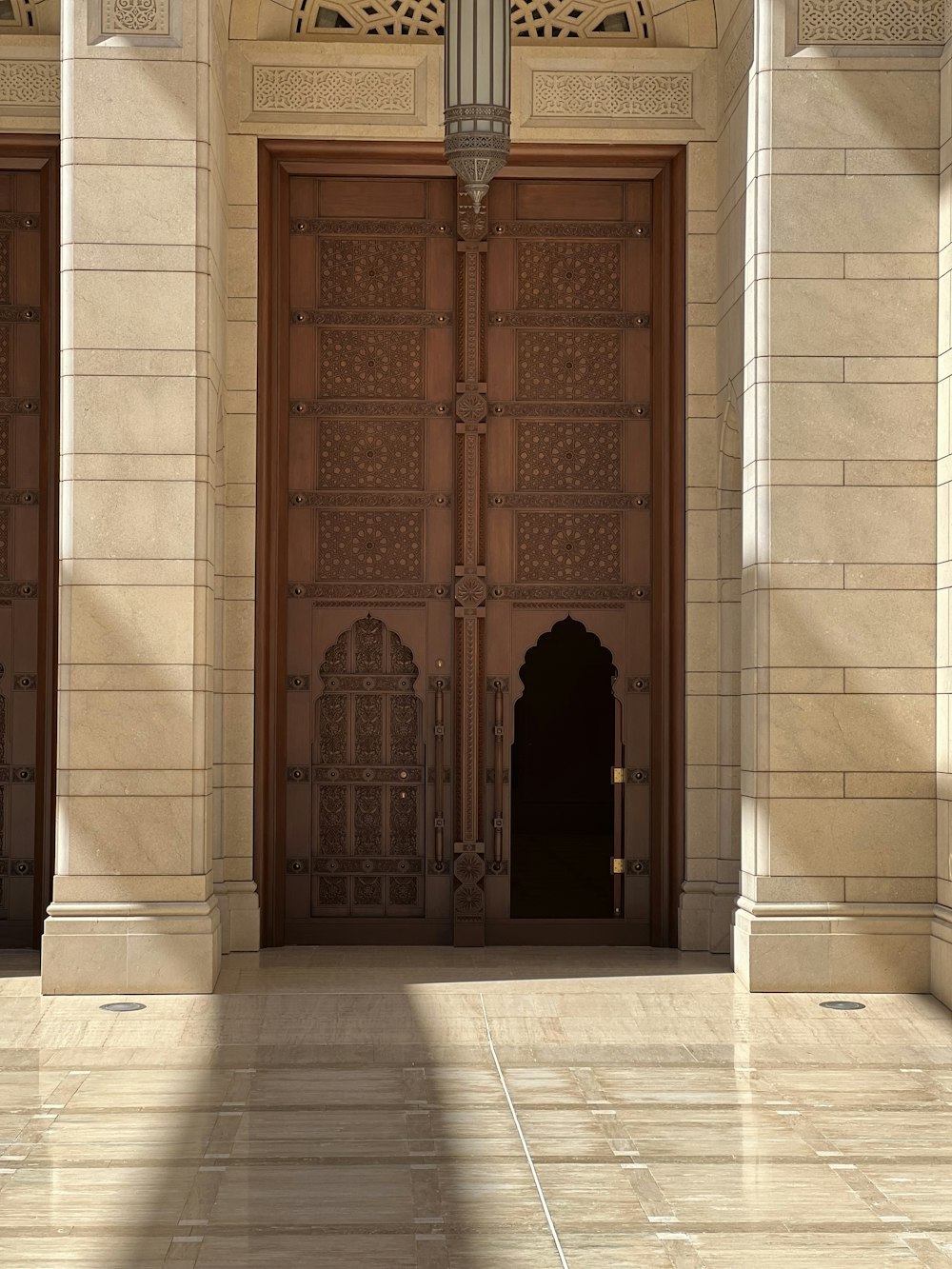 a large wooden door sitting inside of a building