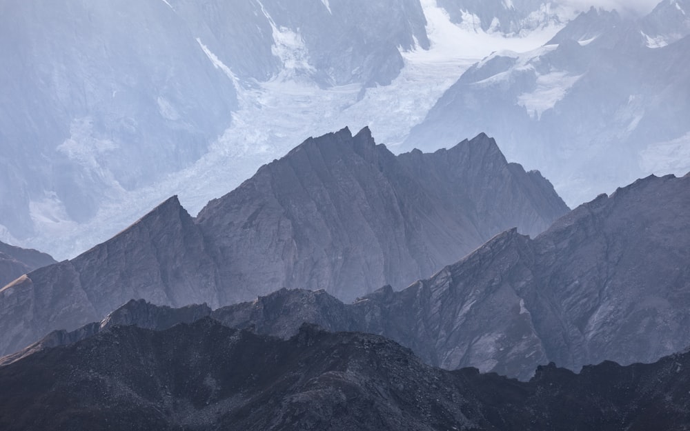 a group of mountains with snow on them