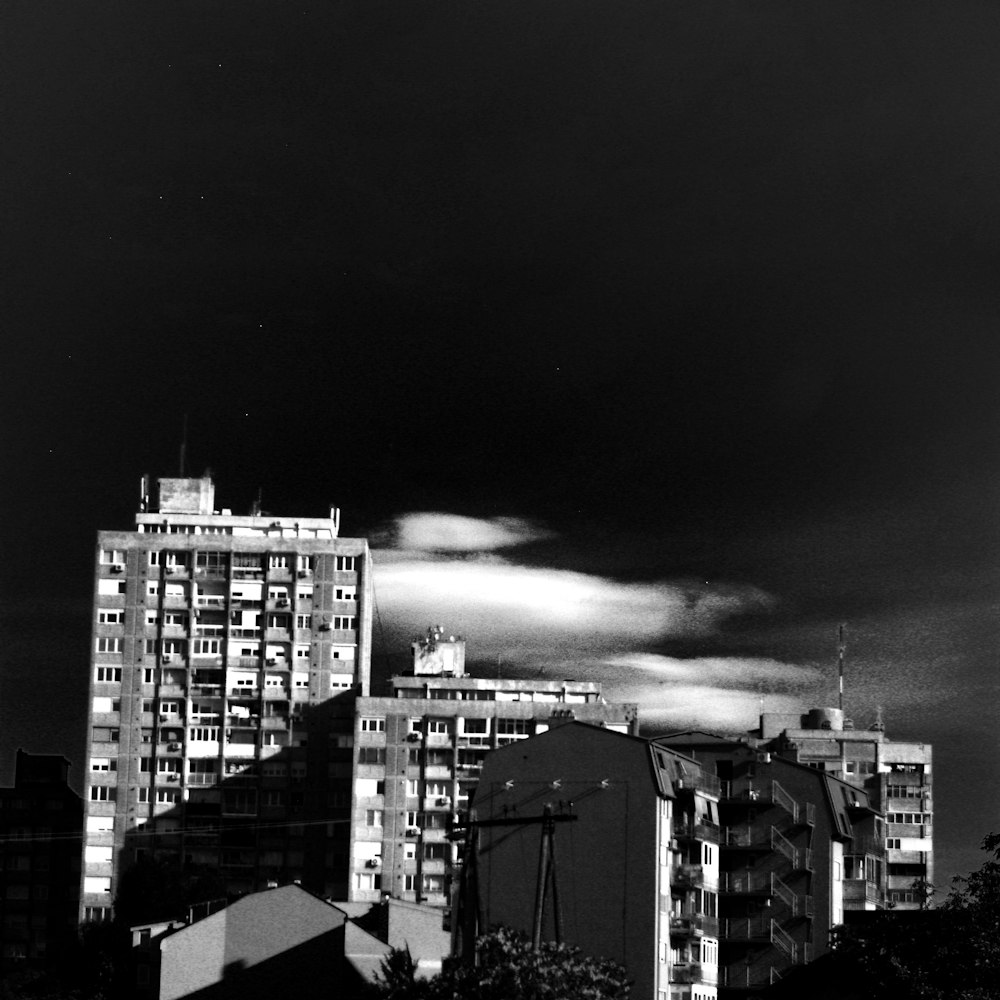 a black and white photo of tall buildings