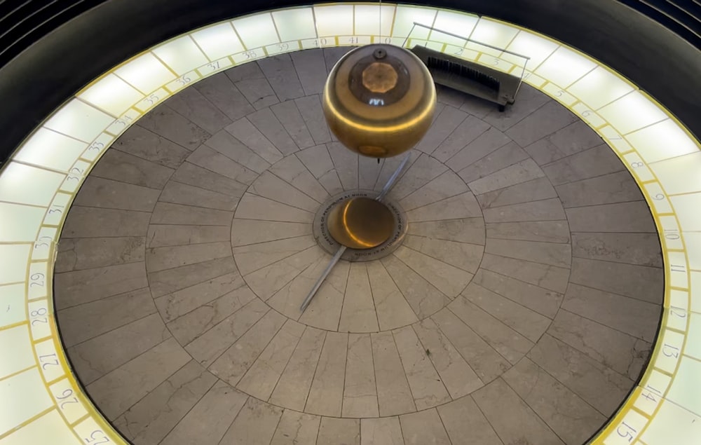 an aerial view of a clock with a circular design