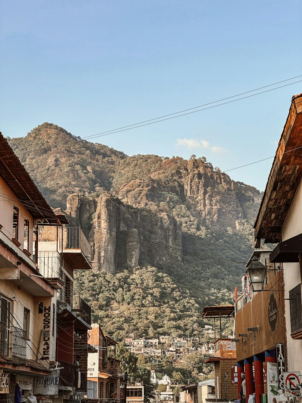 a street with a mountain in the background