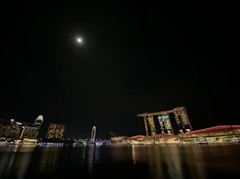 A detailed shot of the iconic Manhattan skyline under a midnight navy sky.