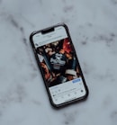 a cell phone sitting on top of a marble counter