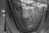 A cinematic scene of a philosopher’s bust surrounded by swirling musical notes and digital light trails.