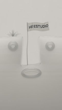 A minimalistic design featuring geometric shapes with a flag in the center that reads 'HI! ESTUDIO'. The background and objects are in muted tones, and the composition is symmetrical with circular elements.