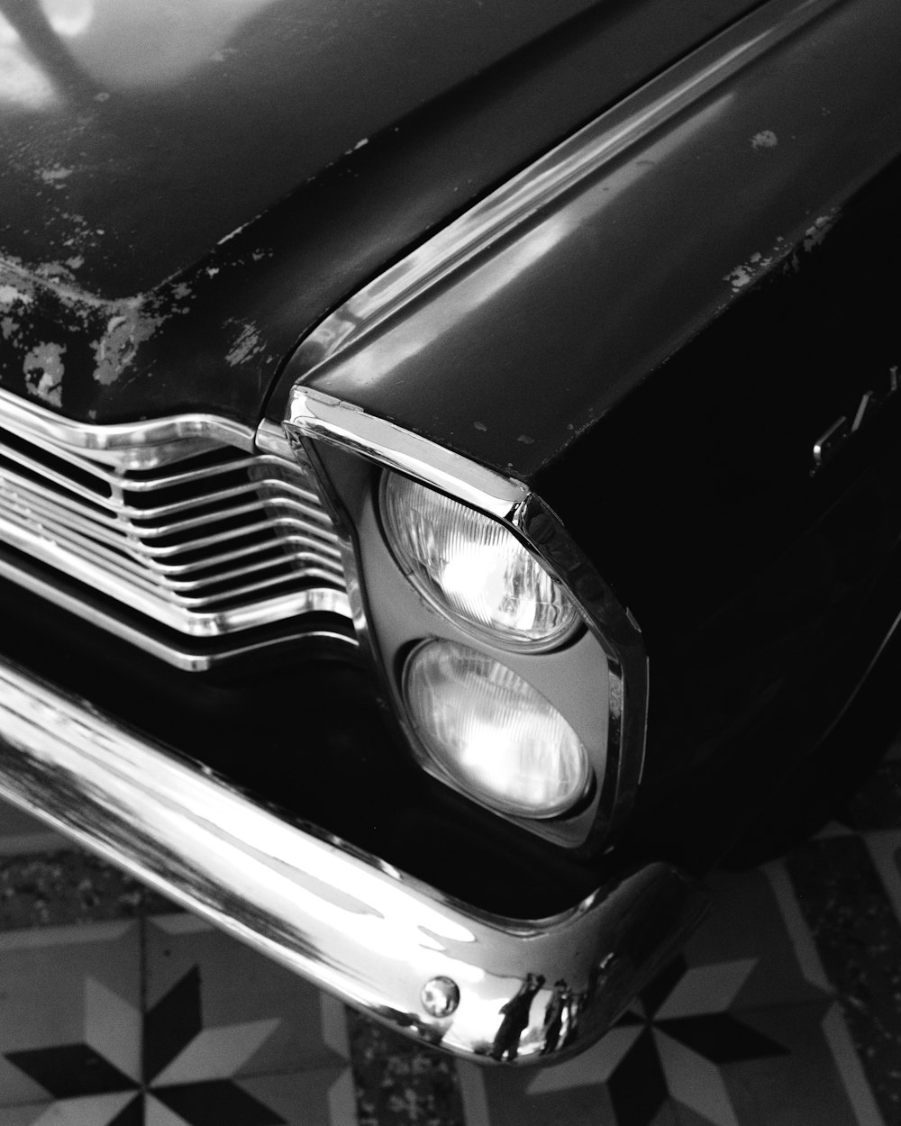 a black and white photo of an old car