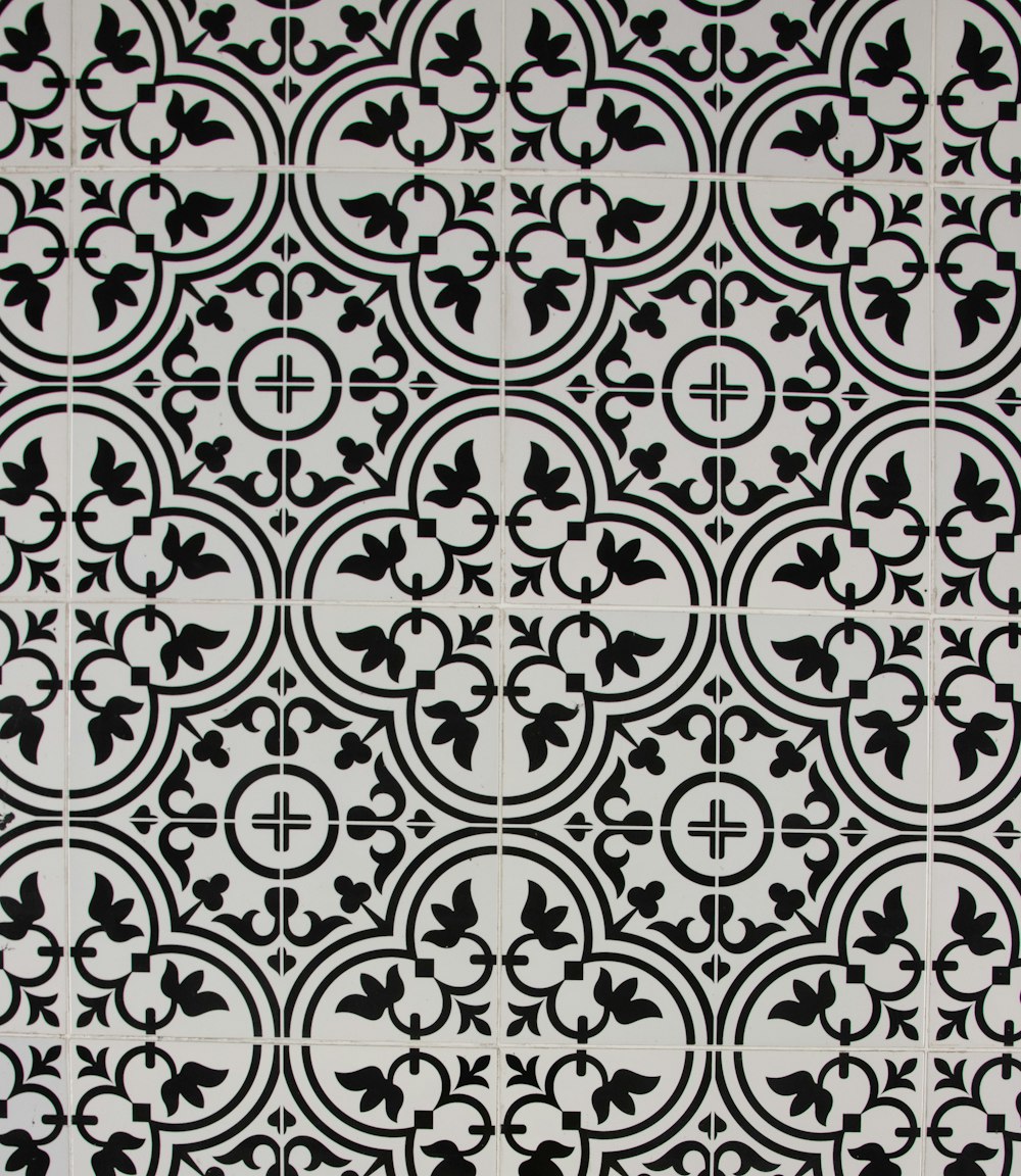 a black and white tile pattern with a cross on it