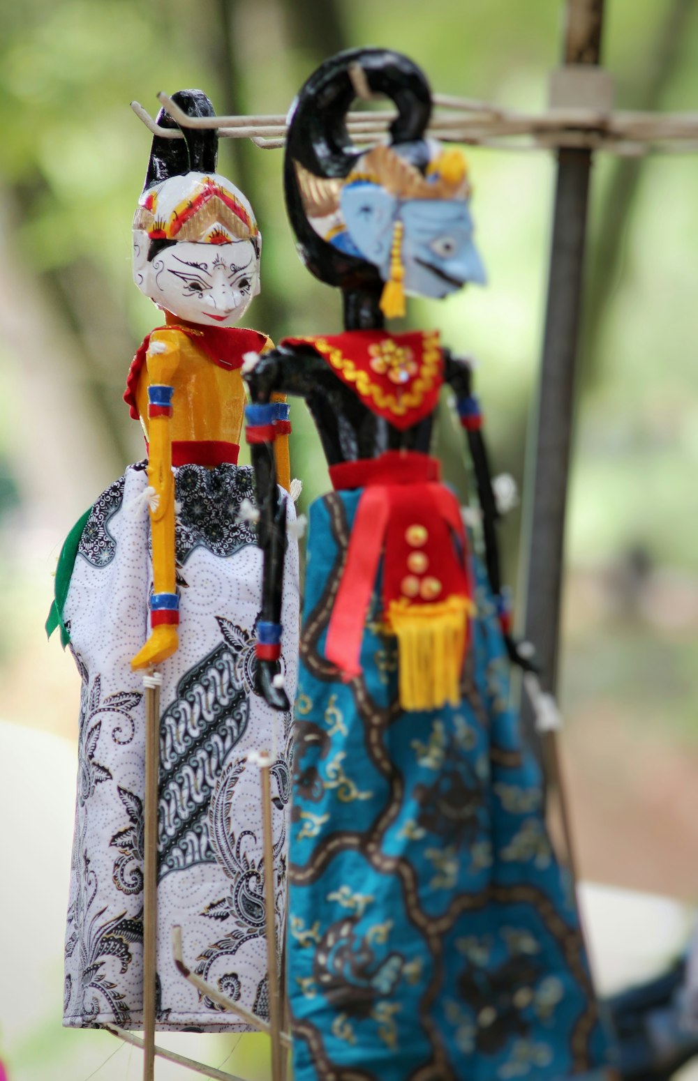 a couple of figurines sitting on top of a table