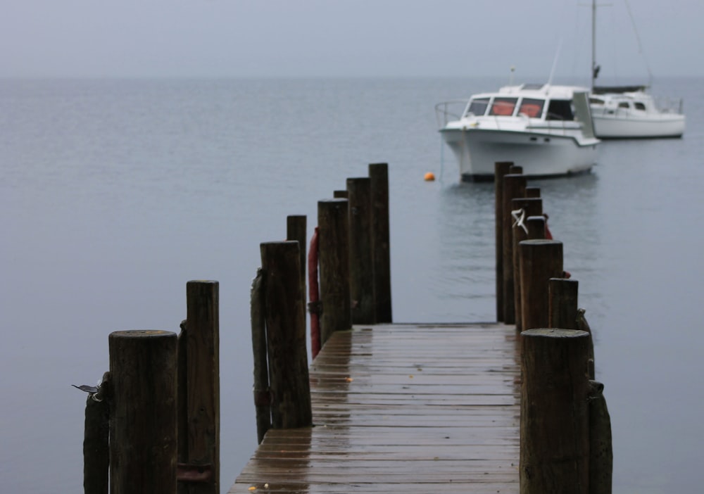 a boat is in the water near a dock