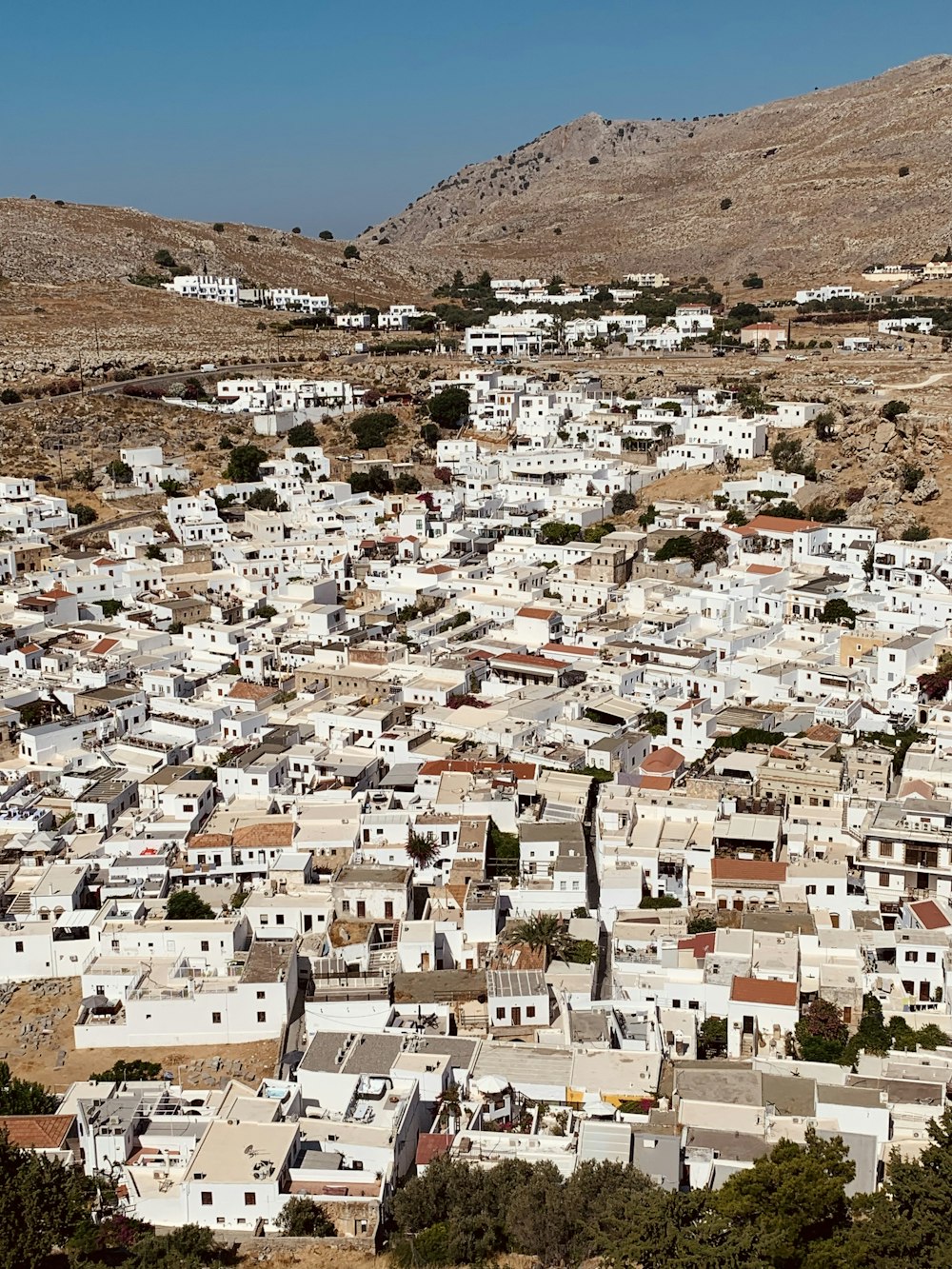 a view of a town in the middle of the desert