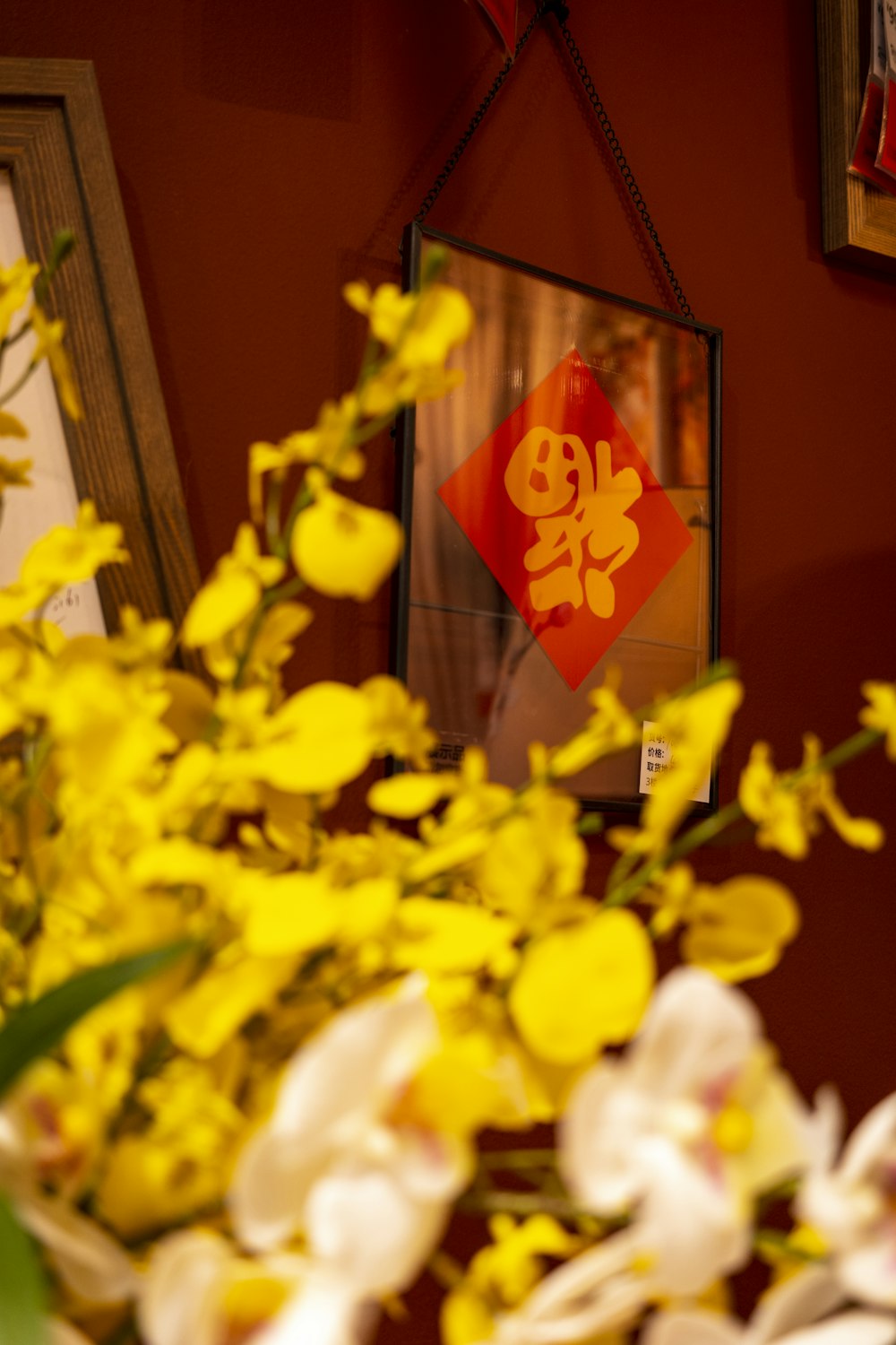 a vase filled with yellow flowers on top of a table