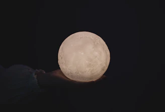 Close-up of a handcrafted mystical relic glowing softly under moonlight.