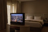 A cozy, well-appointed guest room featuring plush bedding and tasteful decor inviting restful comfort.