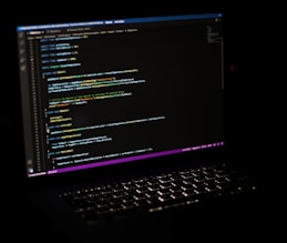 a laptop computer sitting on top of a desk