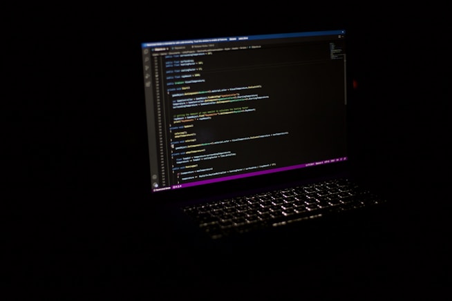 Close-up of laptop screen with code, reflecting the computational aspects of transformer models 