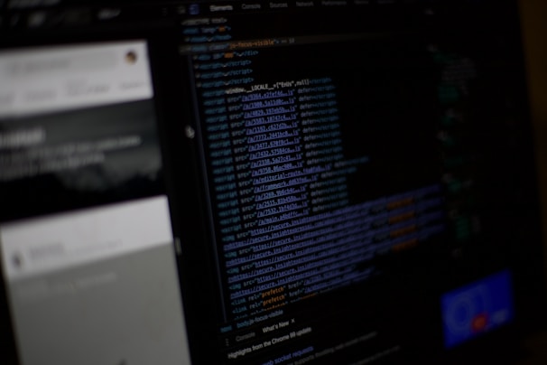 A sleek, dark interface screen showing code snippets and data flow diagrams in white and gray tones.