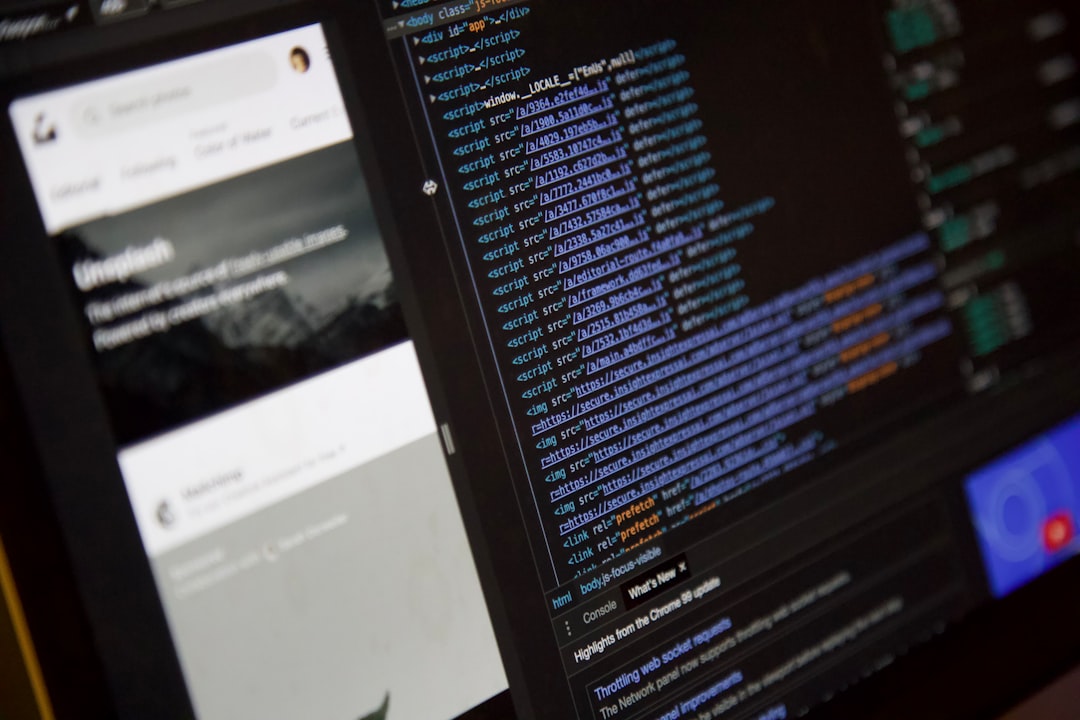a computer screen with a program running on it, Unsplash website in the background with a technical view on the websites source code on the screen in the foreground
