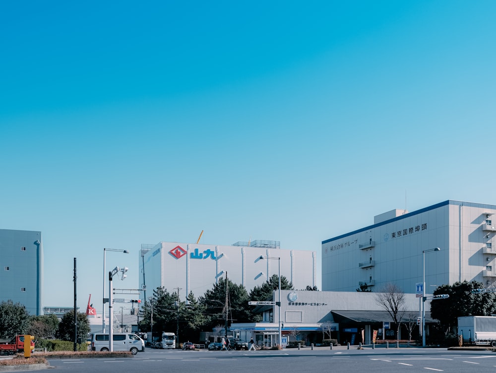 a large white building sitting on the side of a road