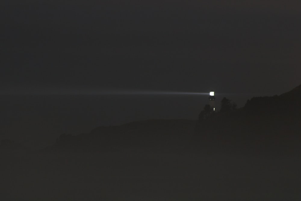 a foggy night with a light in the distance