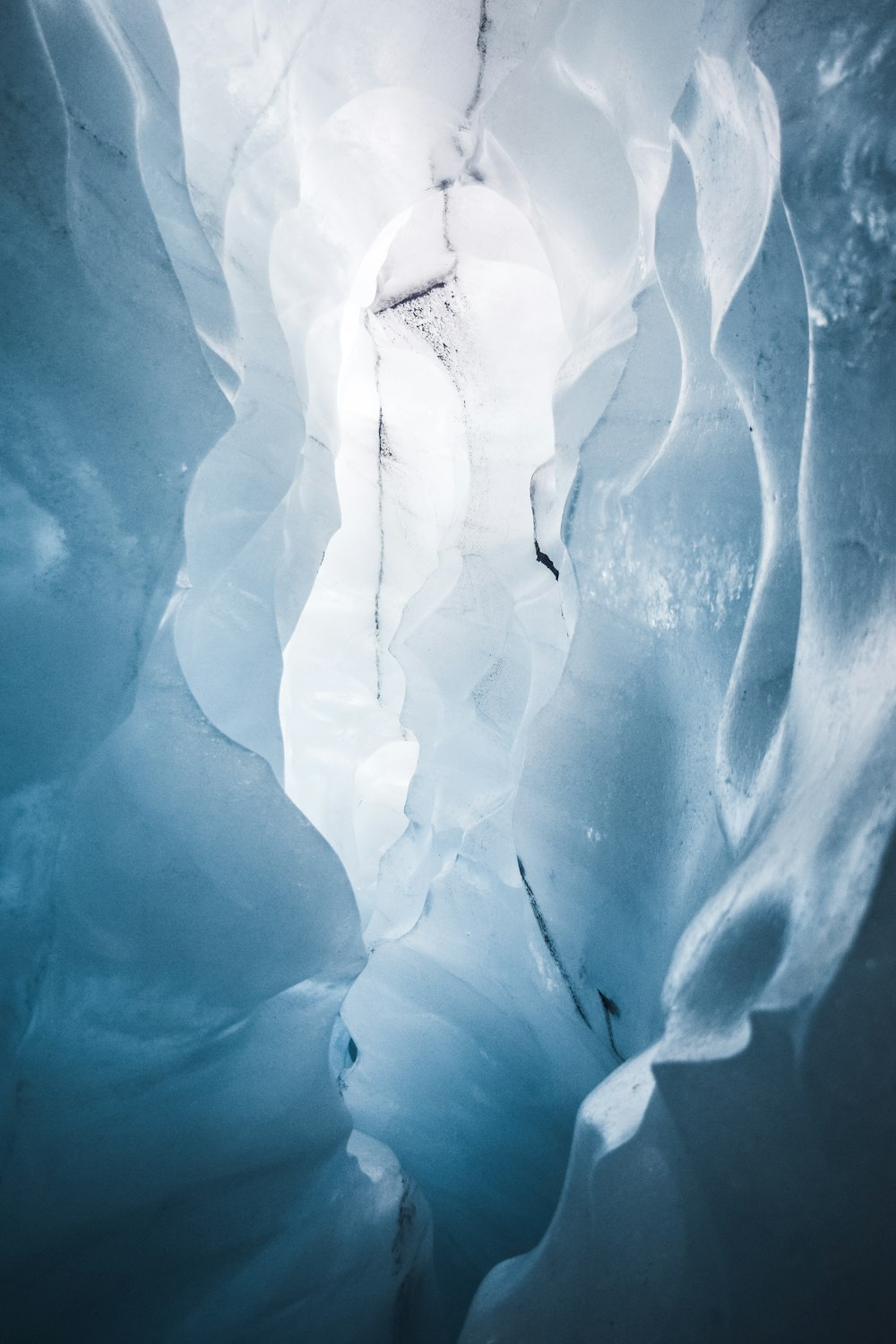 a large ice cave with water inside of it