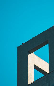 A sleek architectural model highlighting minimalist structural lines and shadow play.