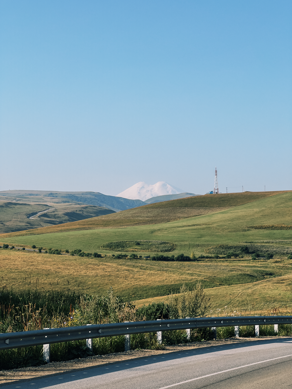 a road with a mountain in the distance