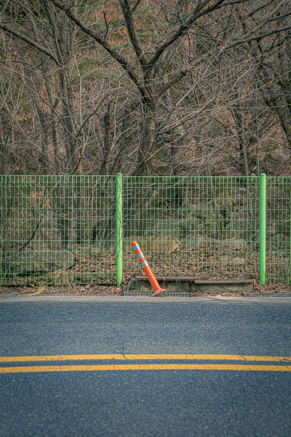 a traffic cone sitting on the side of a road