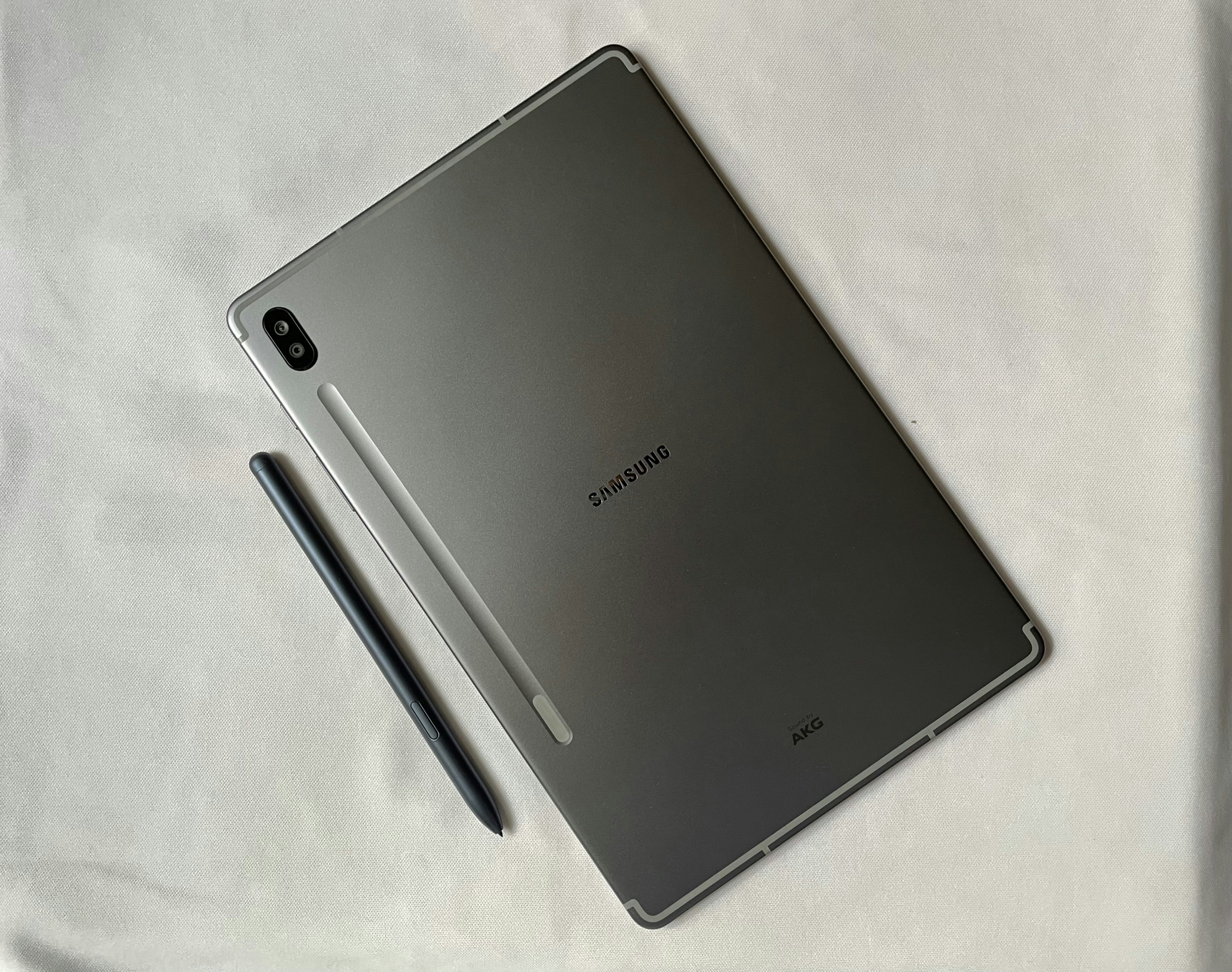 a tablet with a pen on top of it