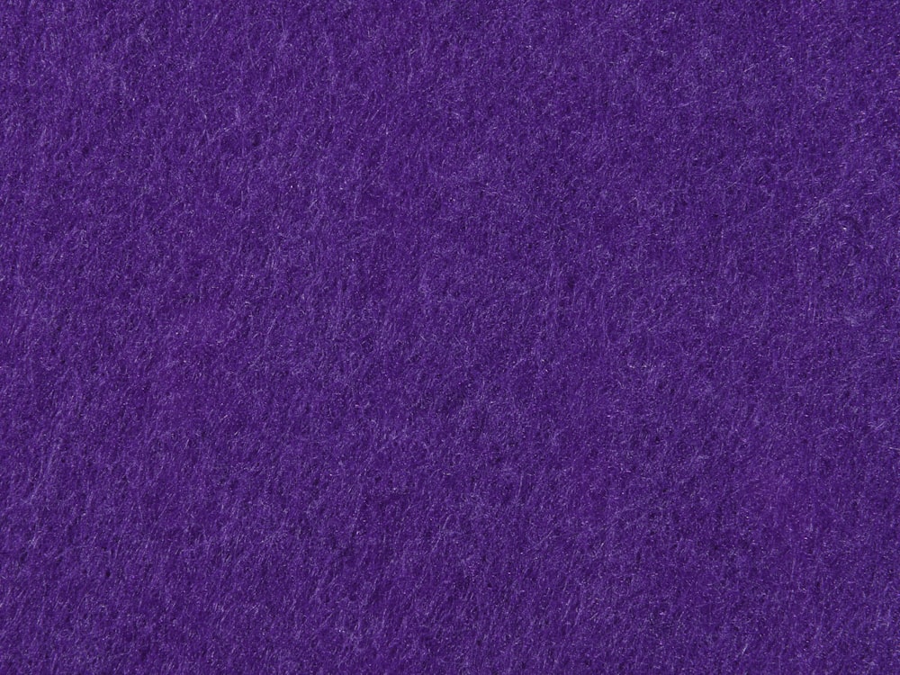 a close up view of a purple background