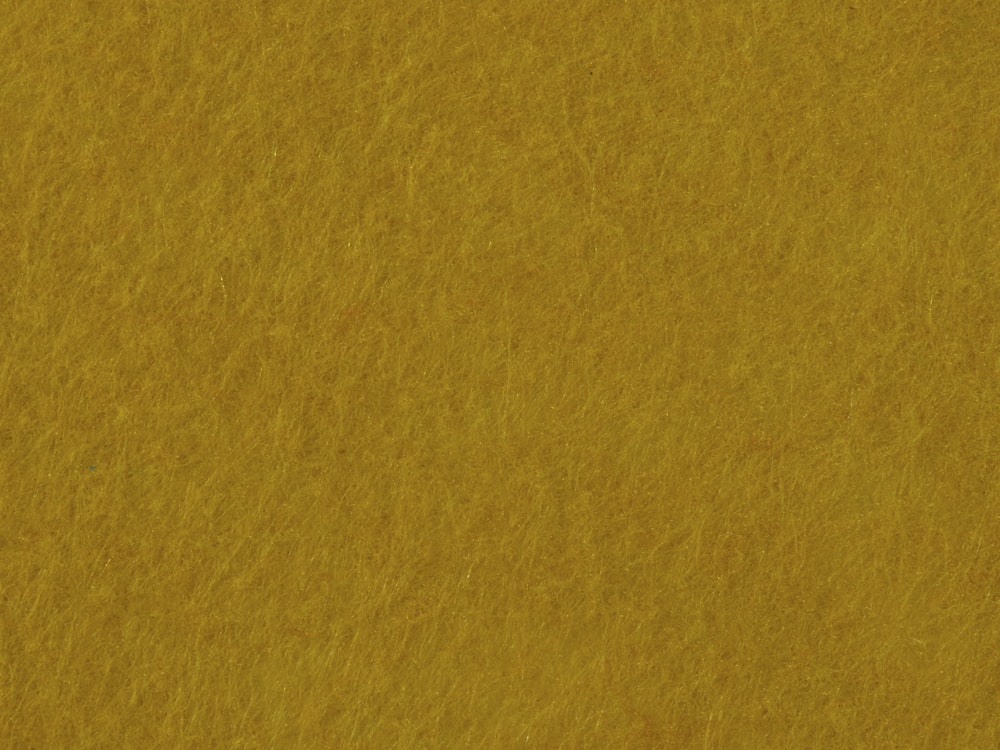 a close up view of a yellow background