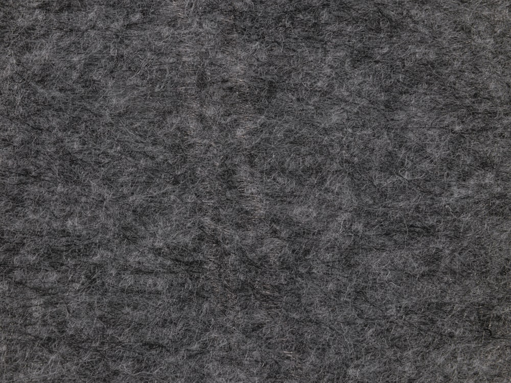 Close view of mottled grey wool showing its natural fibre and tonal variation
