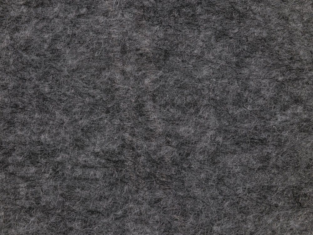 a close up of a black and grey background