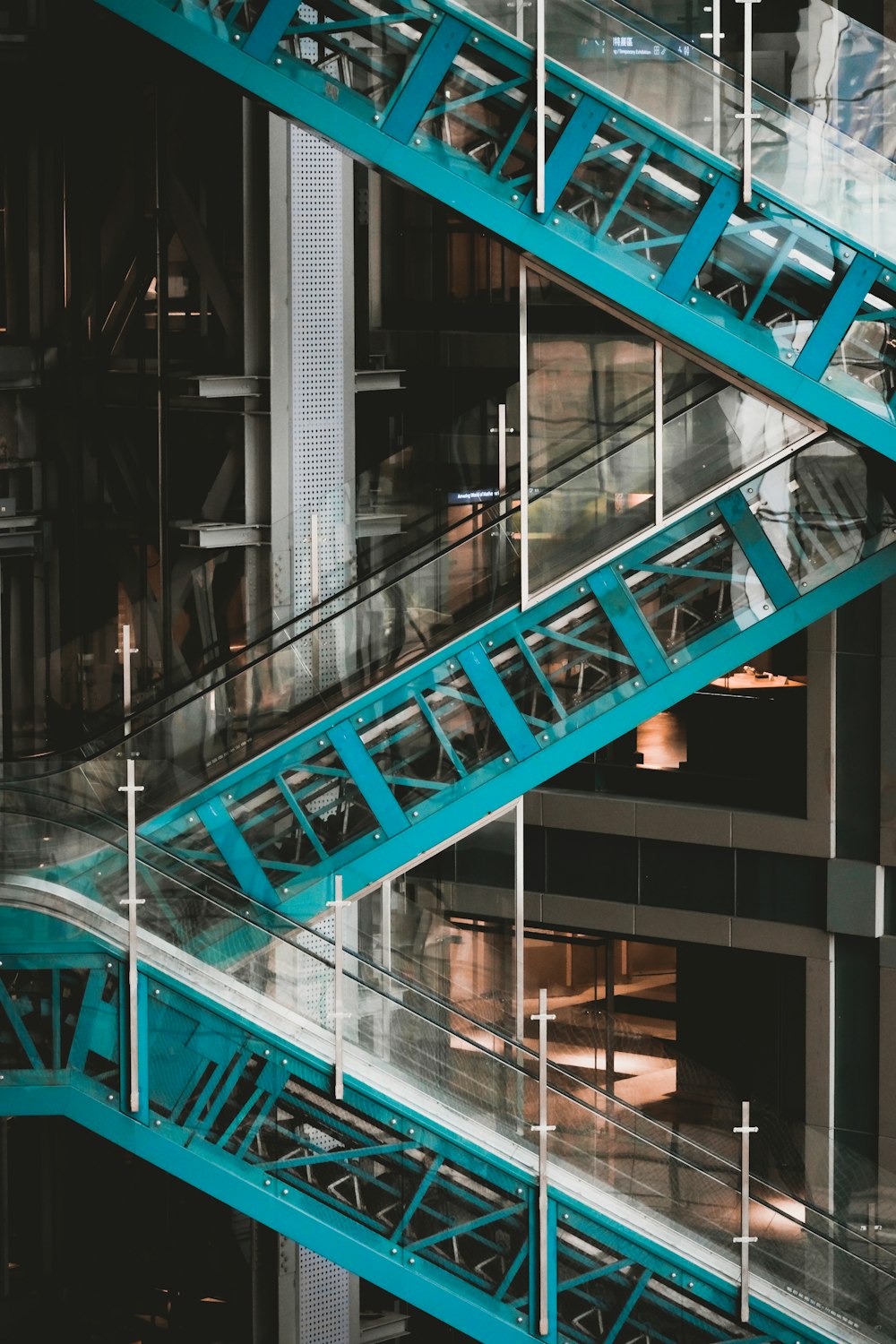 a set of blue metal stairs leading up to a building