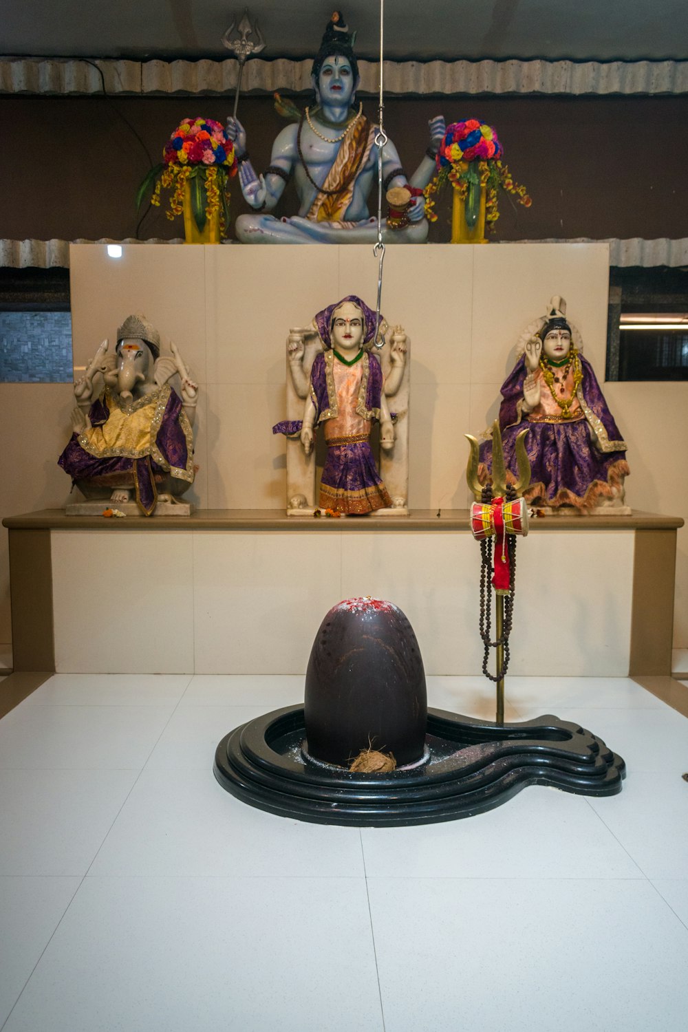 a group of statues sitting on top of a white table