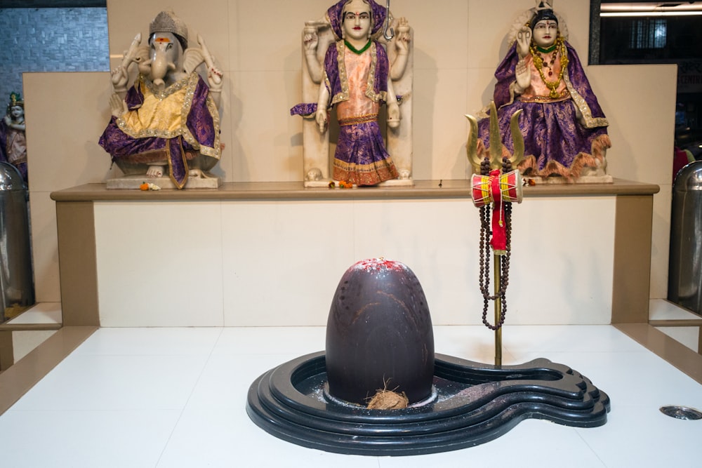 a group of statues sitting on top of a white counter