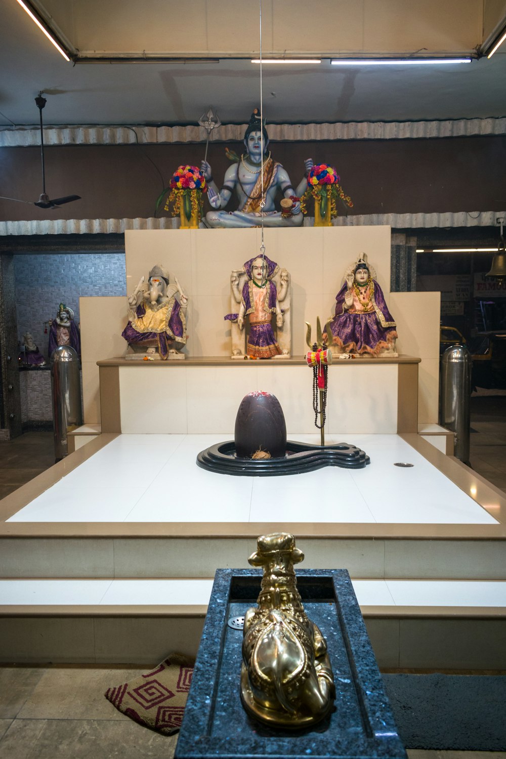 a white table with statues on top of it